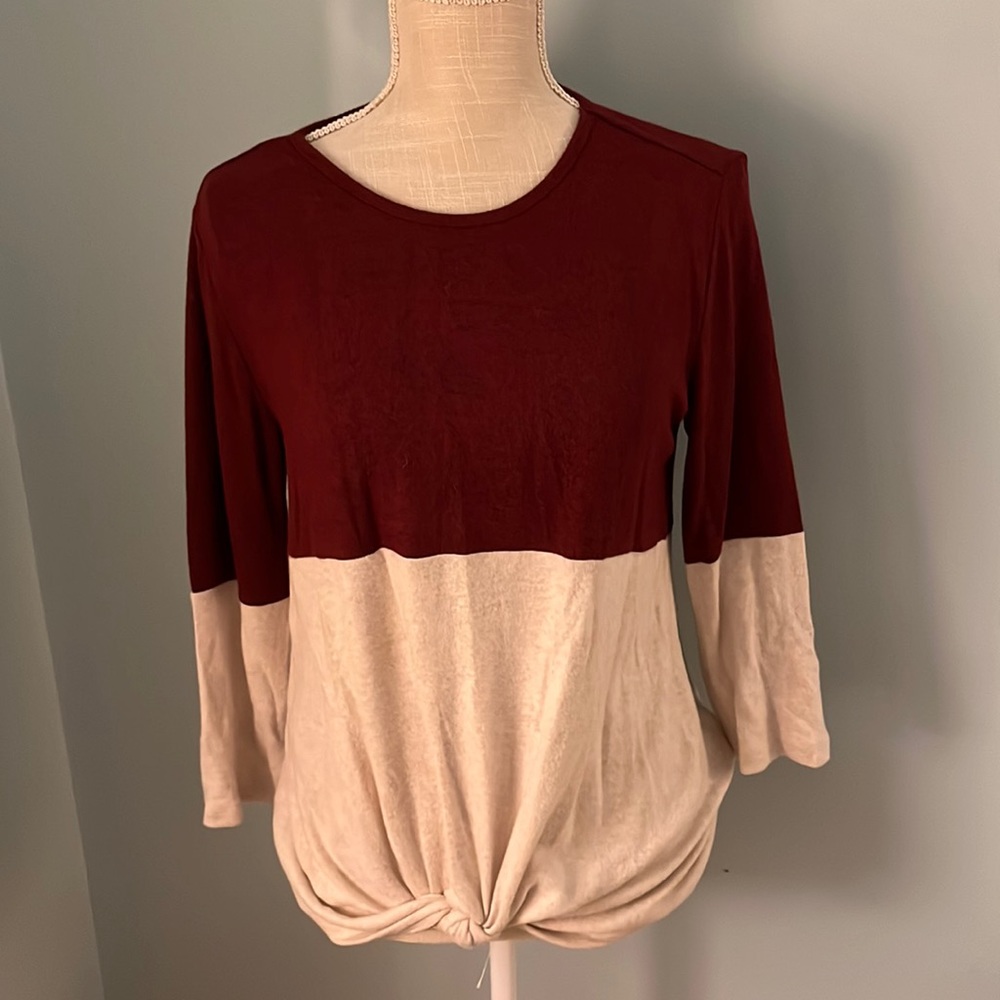 Super soft scoop neck sweater with tie at the waist.